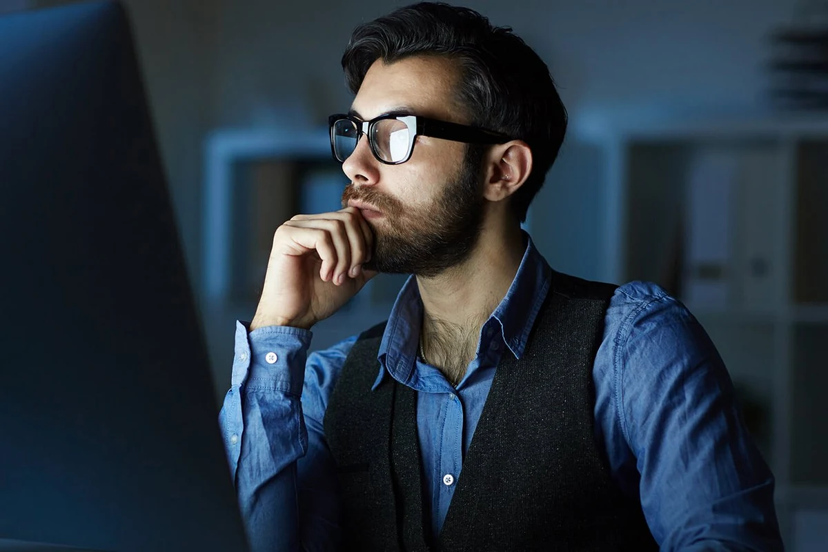 Data analyst reviewing business information and reports
